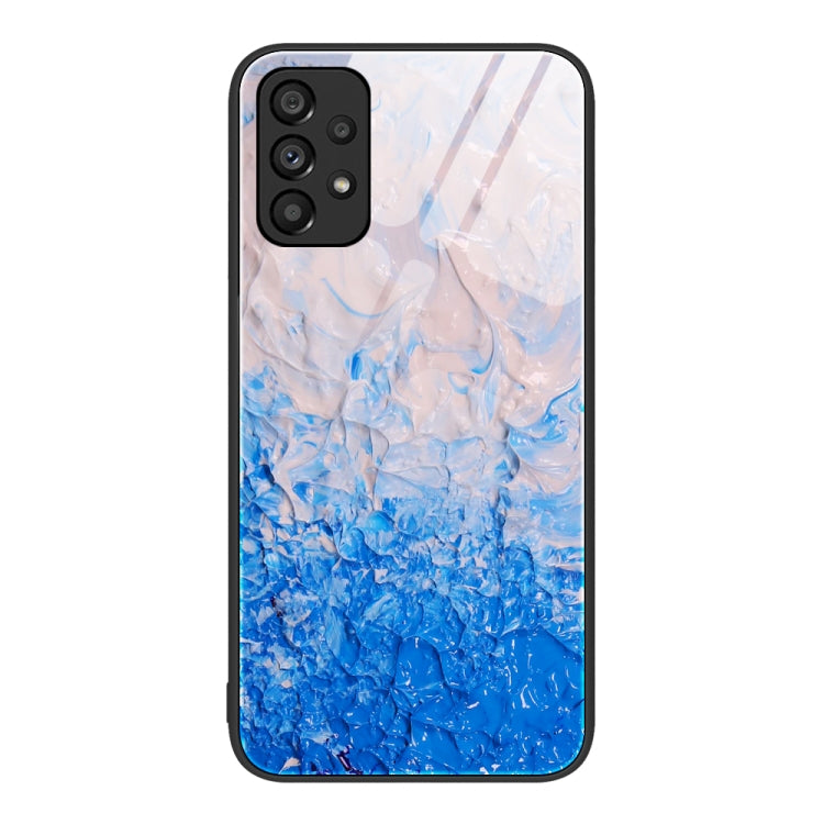 Marble pattern glass phone case with blue watery swirls and camera cutouts