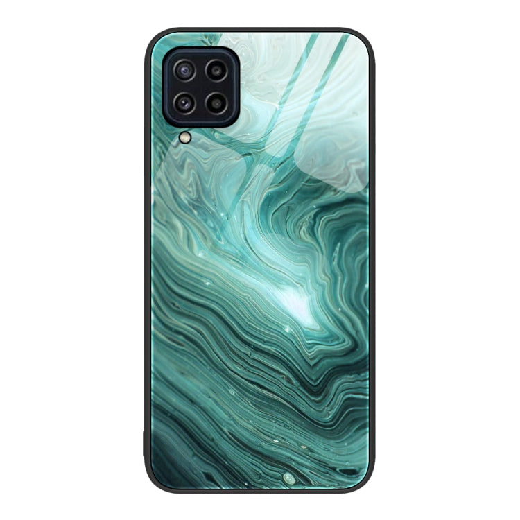 Marble pattern glass phone case with teal green marbled waves, camera cutouts