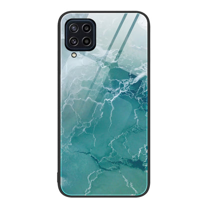Marble pattern glass phone case with aqua green marbled lines and camera cutouts