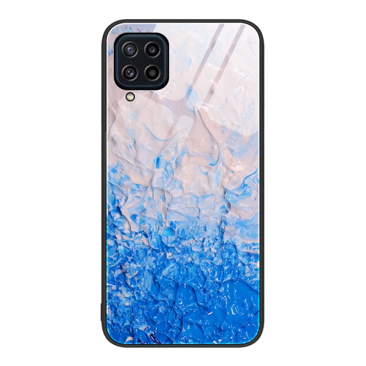 Marble pattern glass phone case with blue watery marbling and camera cutouts