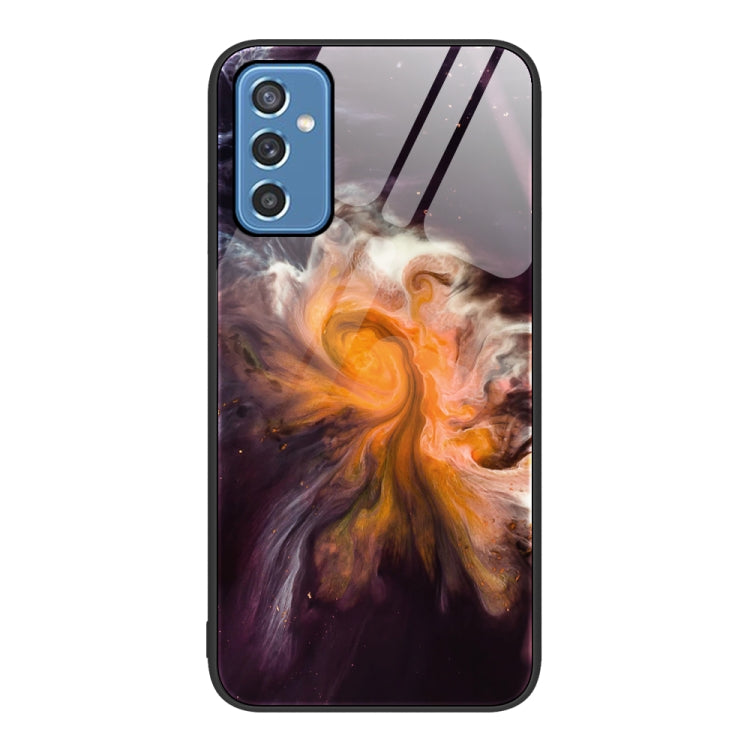 Marble pattern glass phone case with cosmic orange glow swirl and camera cutouts