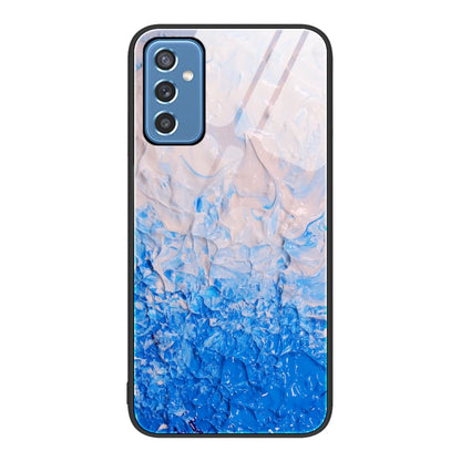 Marble glass protective phone case with light-to-deep blue marble splash and camera cutouts