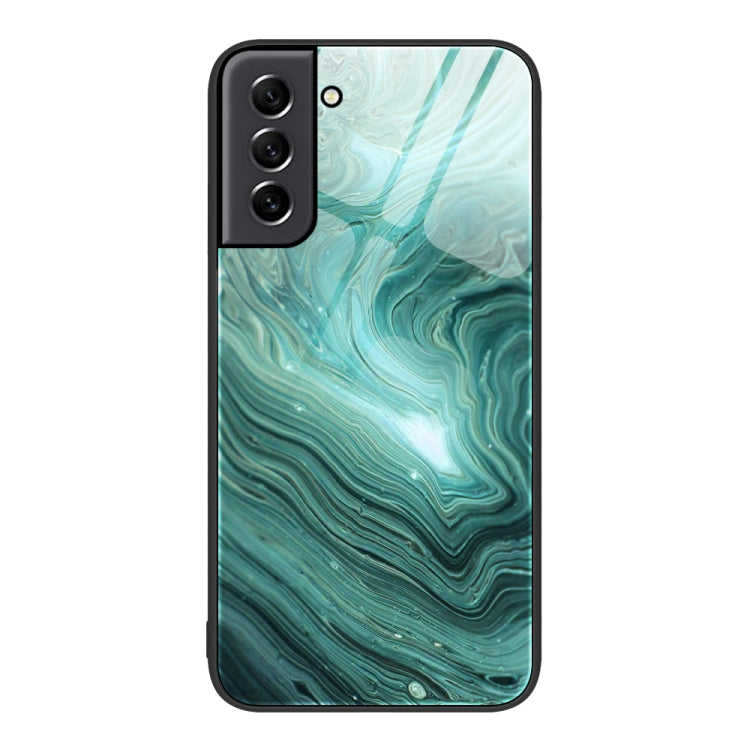 Marble glass protective phone case with teal wave pattern and dual camera module