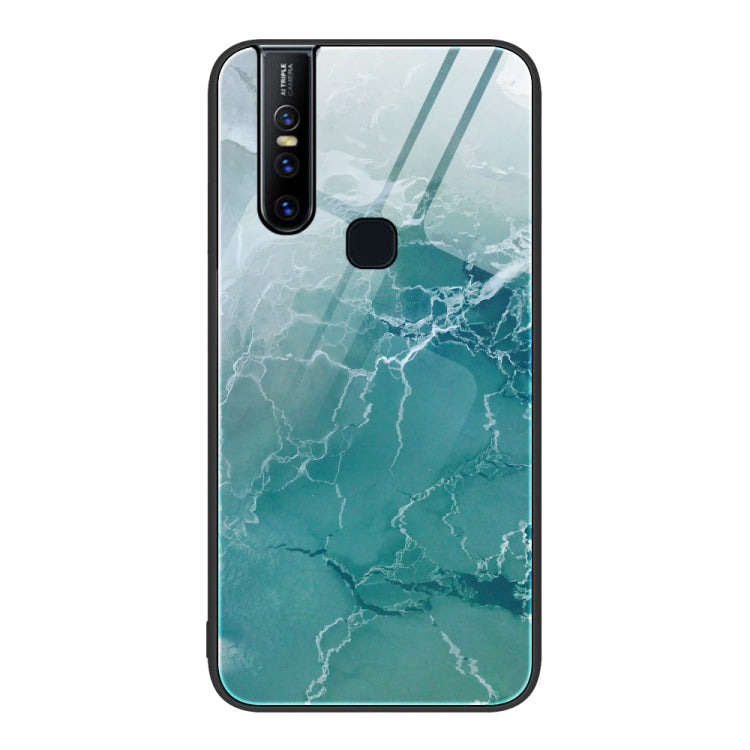 Protective phone case with greenish teal marble crackle pattern and camera cutout