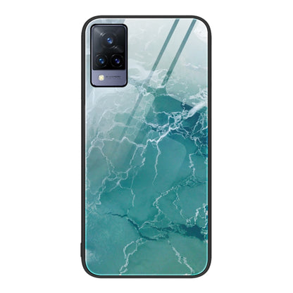 Glass protective phone case with green-blue marble pattern and camera cutouts