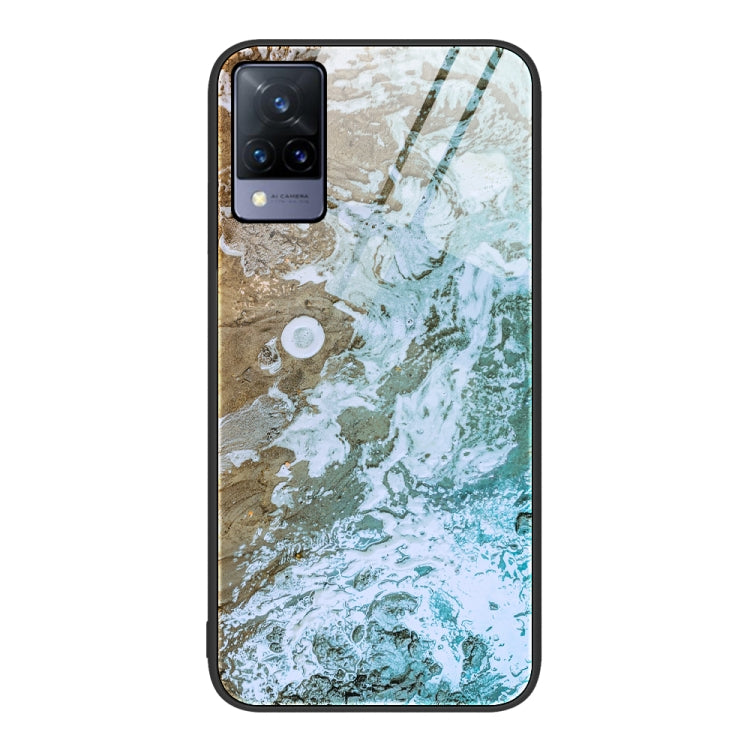 Glass protective phone case with beige, green, and white marbled pattern and camera cutouts
