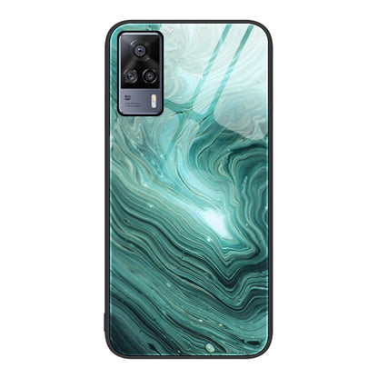 Glass protective phone case with teal wavy marble pattern and camera cutouts