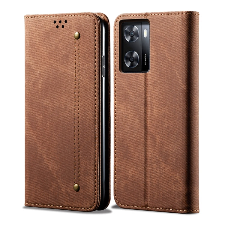Brown denim-textured flip phone case with gold stitching and camera cutout.