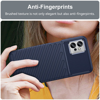 Blue shockproof TPU phone case held in hand, textured back and camera area
