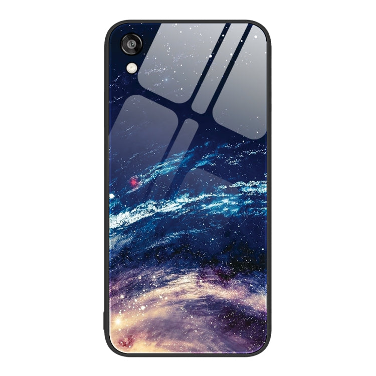 Glass phone case with a starry night scene and blue galaxy landscape illustration.