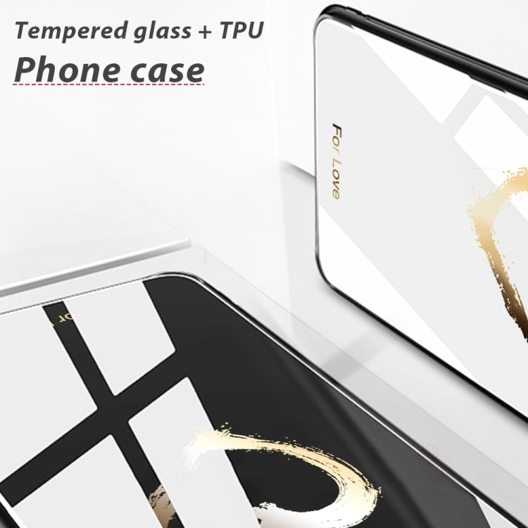 Glass phone case with black edges and a white back featuring gold paint accents.