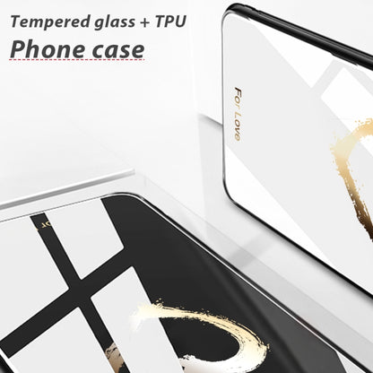 Glass phone case with black edges and a white back featuring gold paint accents.