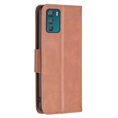 Brown lambskin leather phone case with front flap and side button cutouts