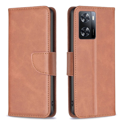 Brown lambskin leather phone case with flap closure and rear camera cutout