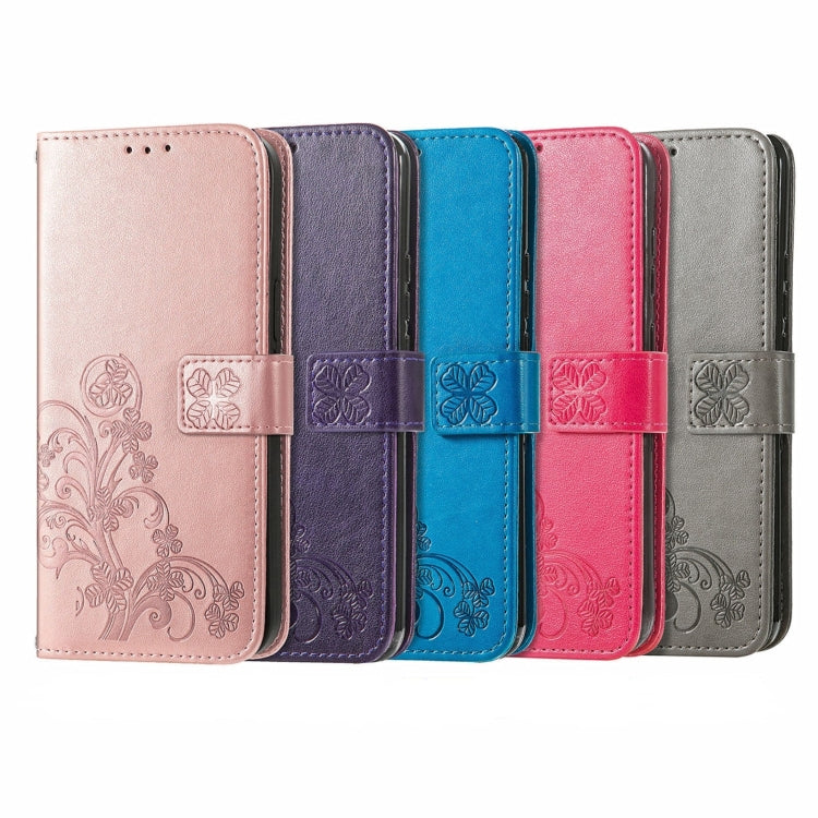 Assorted leather folio phone cases with embossed four-leaf clasp and flip cover