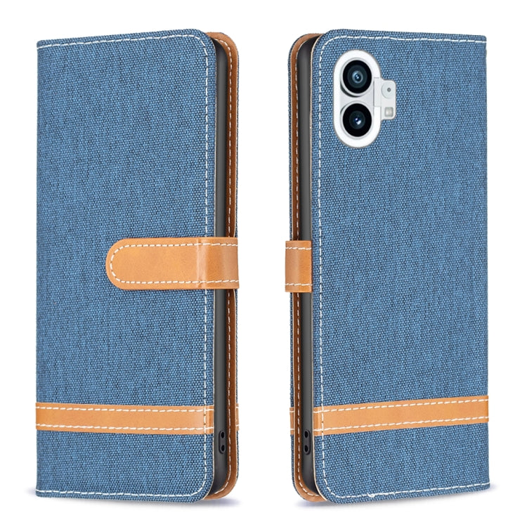 Dark blue woven fabric phone wallet case with tan flip strap and stitched trim