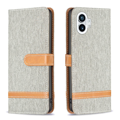Light gray woven fabric phone wallet case with tan flip strap and stitched edges