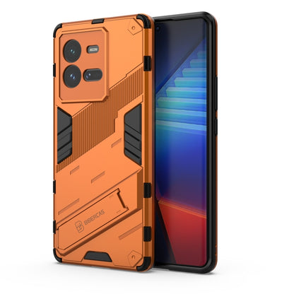 Orange shockproof phone case with bold textured armor and raised camera openings