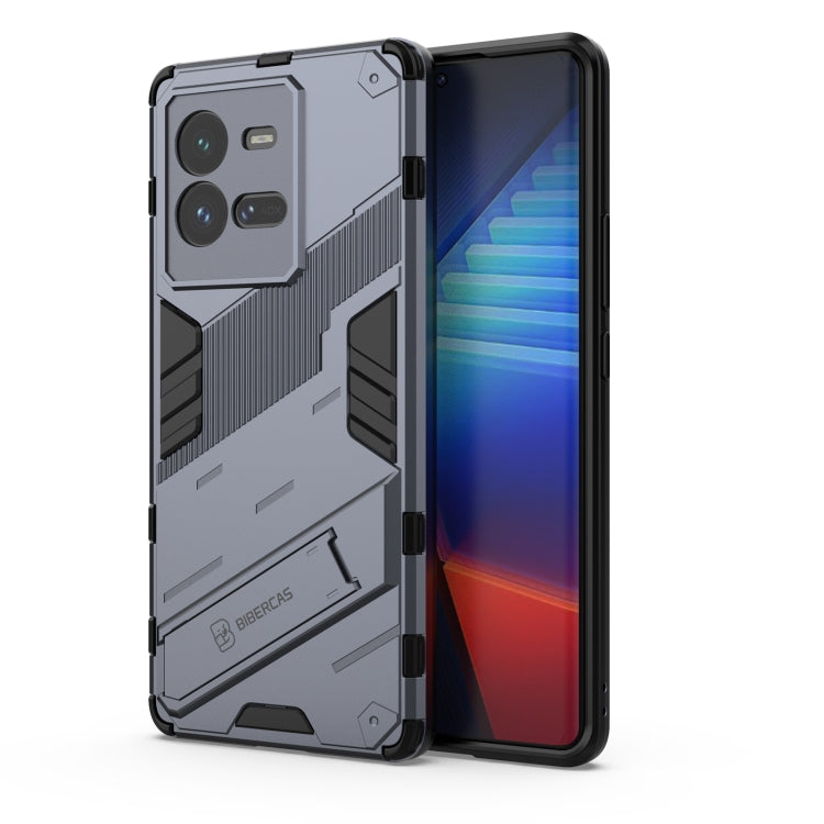 Grey shockproof phone case with rugged armor texture and raised camera cutouts