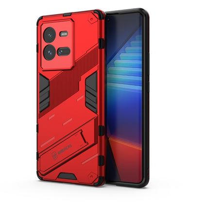 Red shockproof phone case with textured armor design and raised camera openings