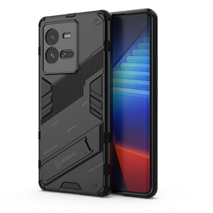 Black shockproof phone case with rugged armor texture and raised camera cutouts