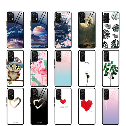 Assorted glass phone cases with various colorful patterns and designs