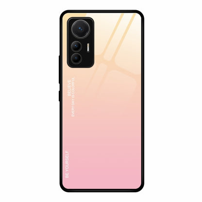 Gradient glass phone case with yellow-to-pink finish and cutouts for triple cameras