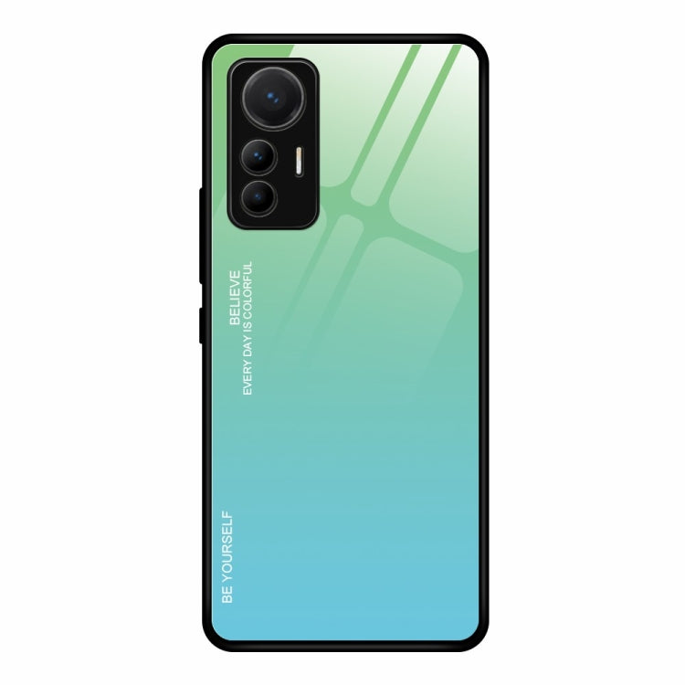 Gradient glass phone case with green-to-cyan finish and cutouts for triple cameras