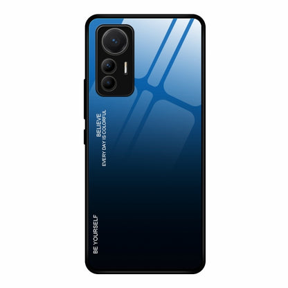Gradient glass phone case with blue-to-black finish and cutouts for triple cameras