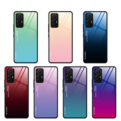 Multiple gradient glass phone cases showing different color finishes and triple-camera cutouts