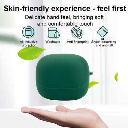Green silicone earphone protective case held in hand