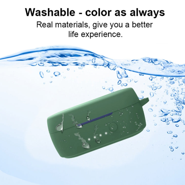 Dark green silicone earbud case with lid closed, with water droplets over it.