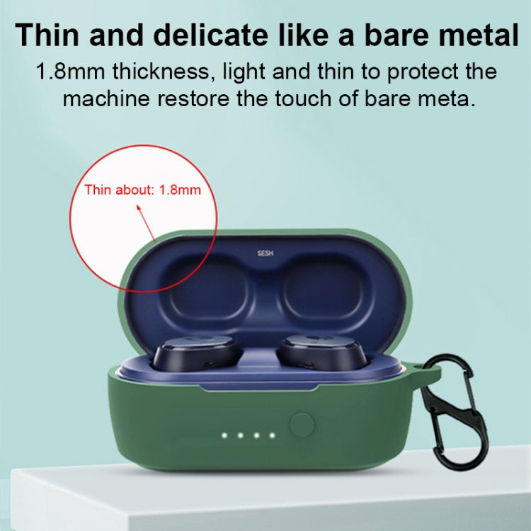 Dark green silicone earbuds case with lid open, earphones inside.