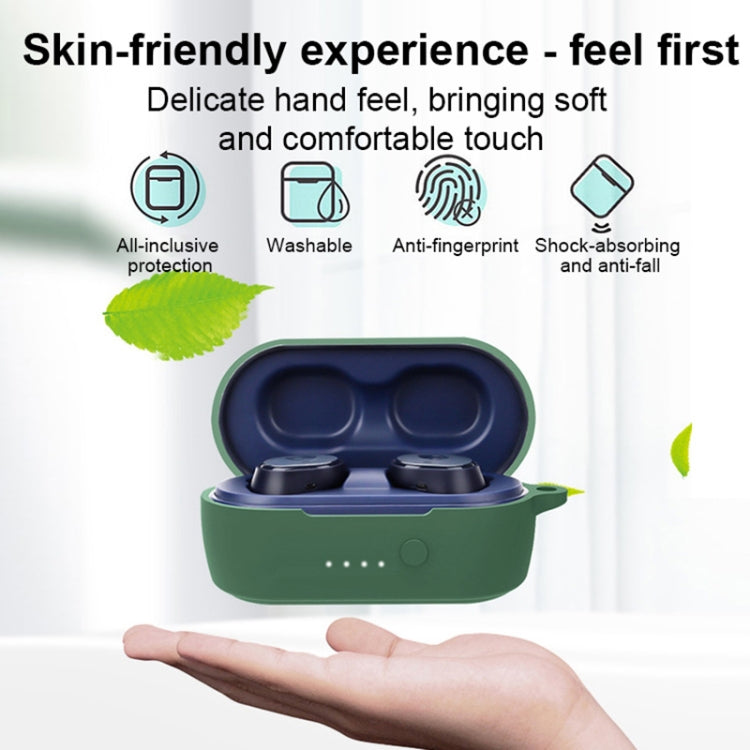 Dark green silicone earbuds case held in a hand, lid open with earphones inside.