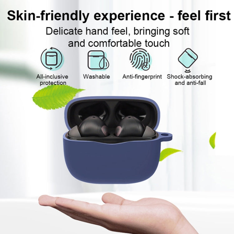 Blue silicone Bluetooth earphone case in hand, open with earbuds visible