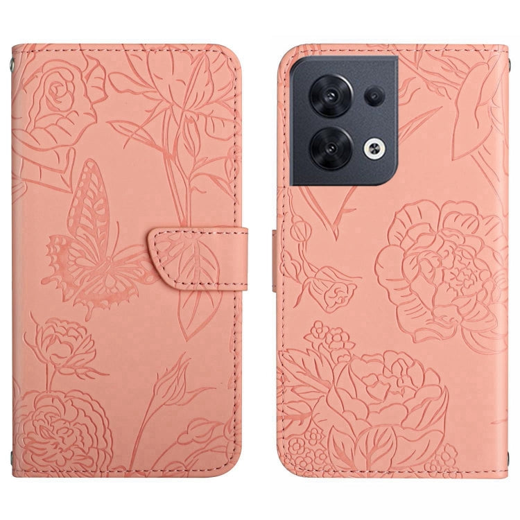 Pink embossed butterfly flip leather phone case with stitched fold-over strap