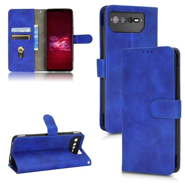Blue leather folio phone case with magnetic closure, card slots, and camera cutout