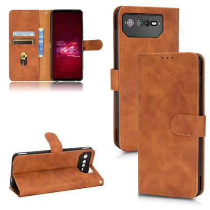 Brown leather folio phone case with magnetic closure, card slots, and camera cutout