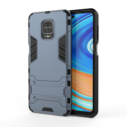 Navy blue rugged protective phone case with camera cutout and textured side grips