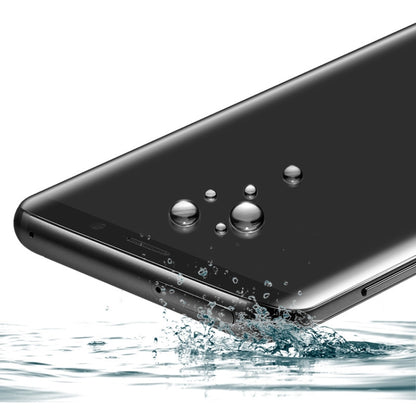 Tempered glass screen protector showing water droplets on a curved surface