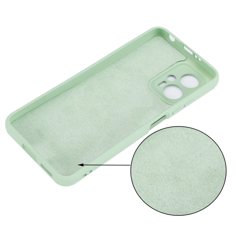 Green silicone phone case with camera opening and textured interior padding