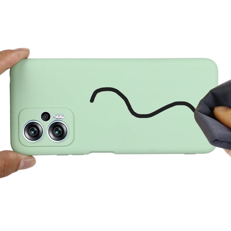 Green liquid silicone phone case with camera cutouts and shockproof bumper