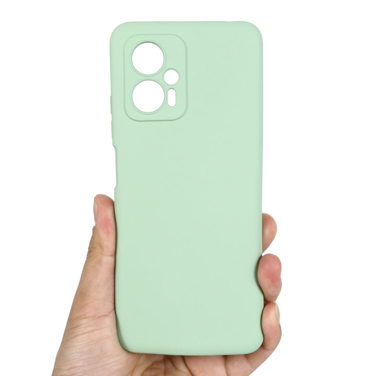 Green silicone phone case with top camera openings and side button cutouts