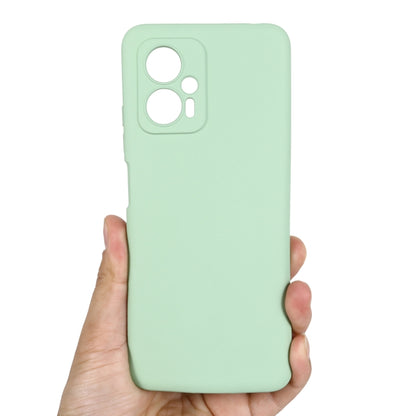 Green silicone phone case with top camera openings and side button cutouts