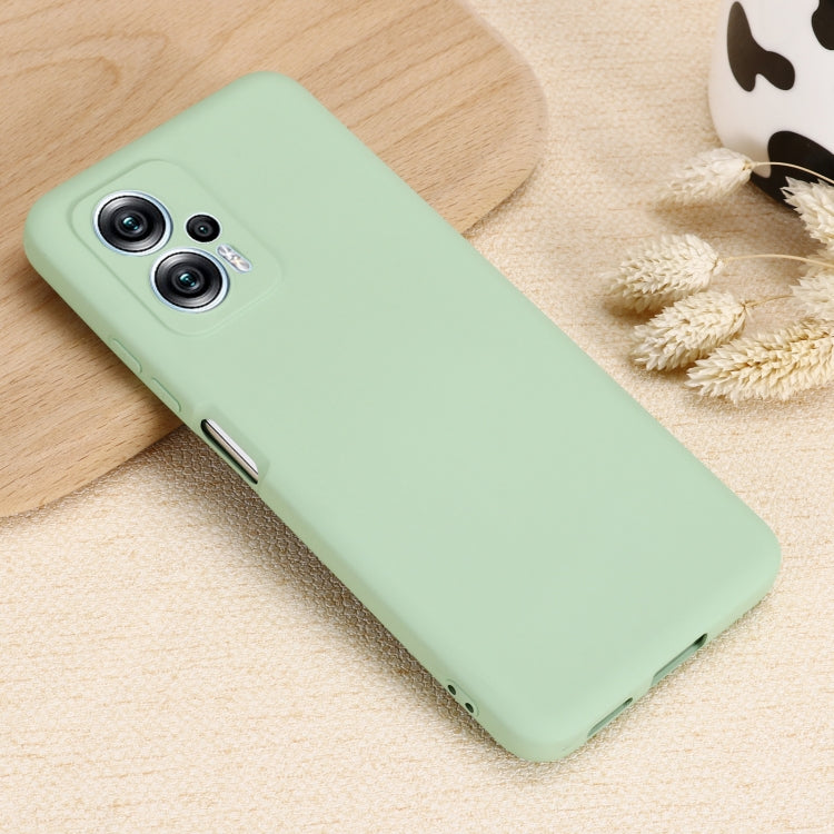 Green liquid silicone phone case with camera module cutout and side port access