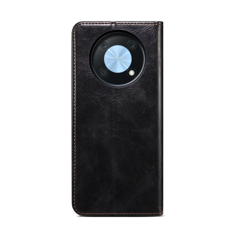 Black leather phone case with circular camera cutout and textured oil-wax crazy horse finish
