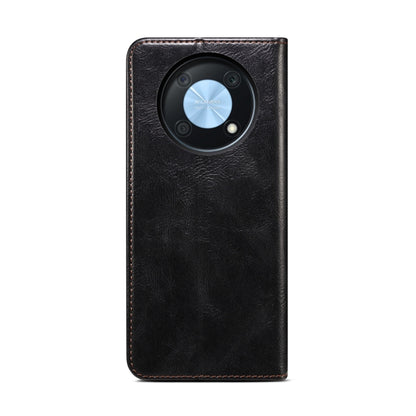 Black leather phone case with circular camera cutout and textured oil-wax crazy horse finish
