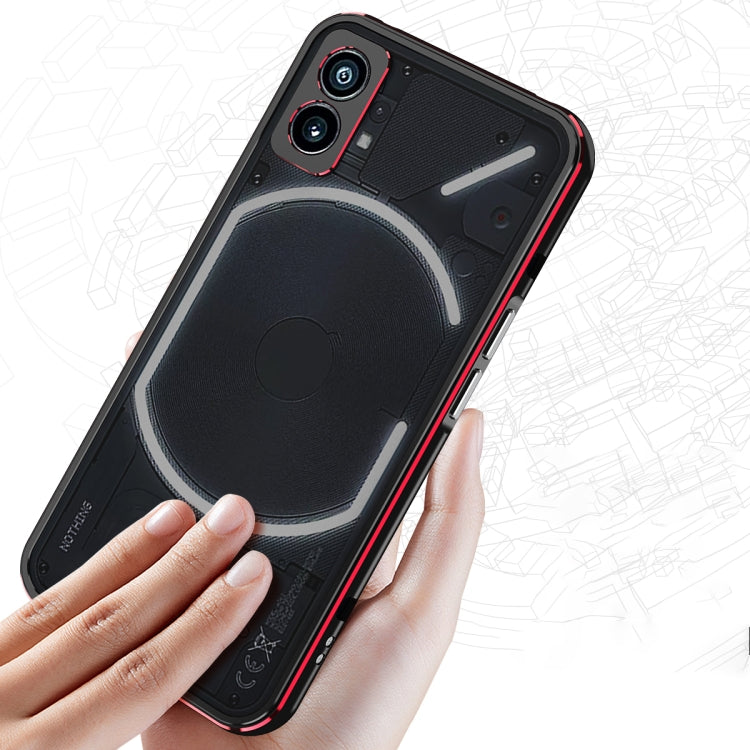 Protective phone case with lens cover, black with red trim, held in hand with camera cutouts