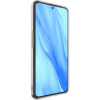 Clear slim TPU phone case covering a blue phone front with protective edges