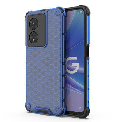 Shockproof phone case with honeycomb pattern, blue with raised camera cutouts.